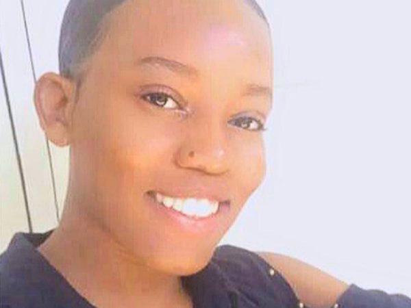 A woman smiling brightly