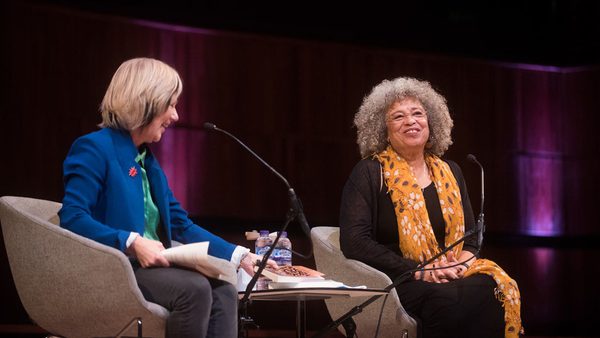 Jude Kelly and Angela Davis sit on stage at WOW London in 2019